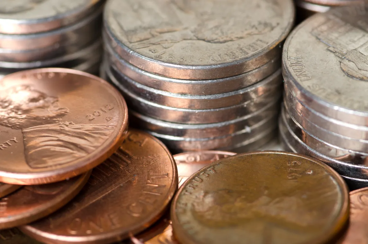 A close view of the obverse and reverse sides of a copper Lincoln Wheat Cent.