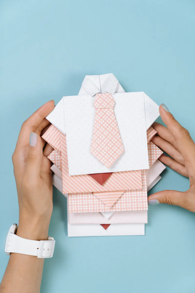 An advanced origami crease pattern printed flat on paper with intricate geometric fold lines