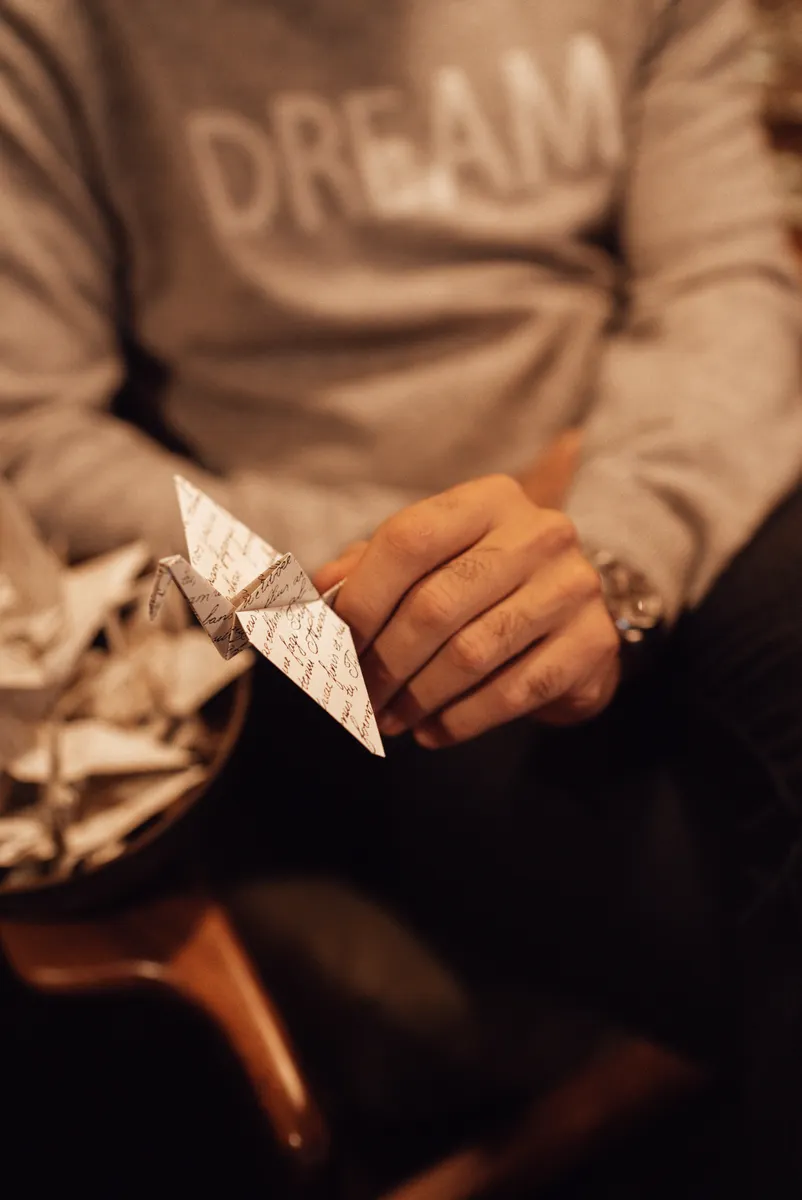 An affordable collection of basic origami supplies laid out neatly for a beginner paper folder.