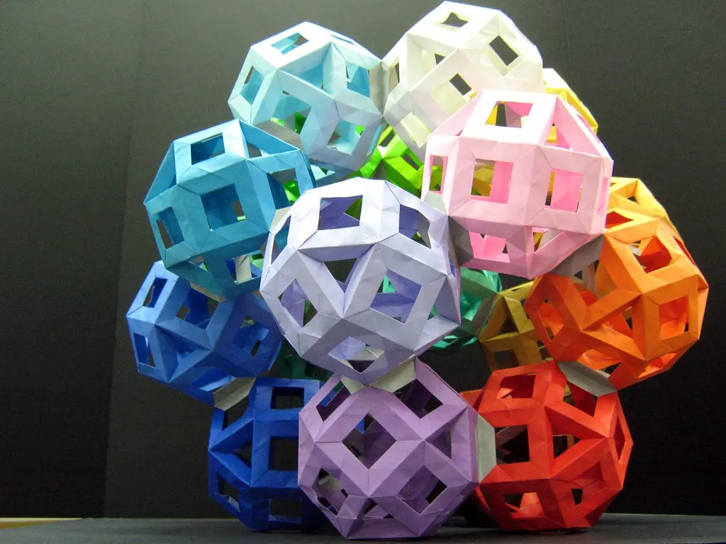 A fully organized craft table with storage for modular paper folding projects.