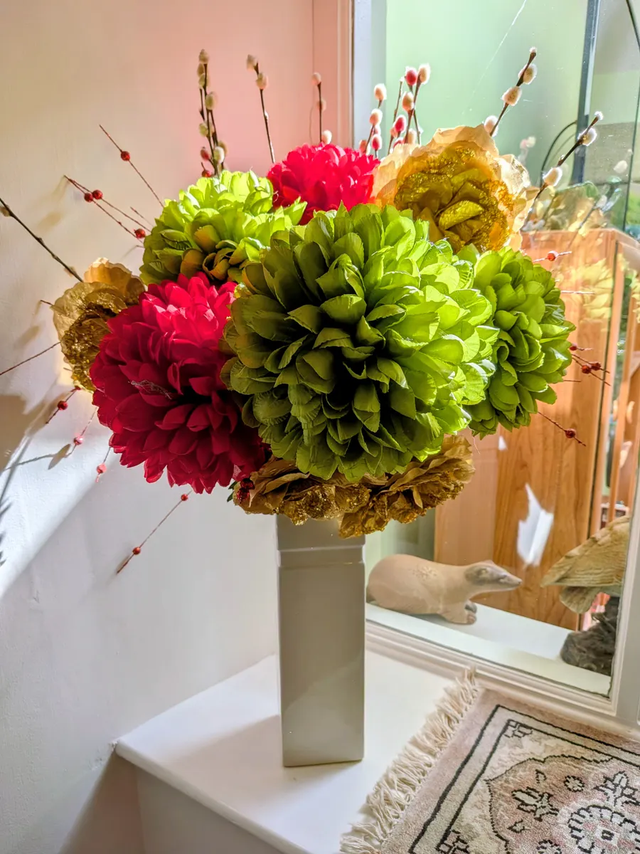 A decorative kusudama paper flower ball displayed as a colorful centerpiece.