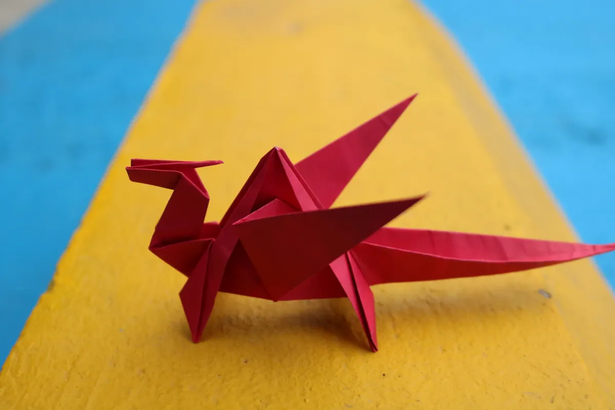 A completed multi-unit kusudama decorative paper sphere displayed on a table.