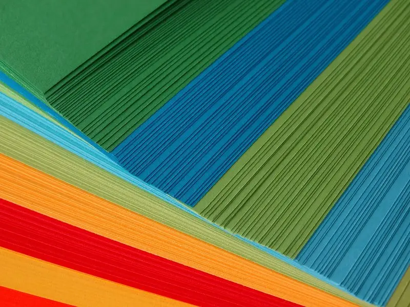 A selection of medium weight kami paper sheets laid out flat for a paper folding project.