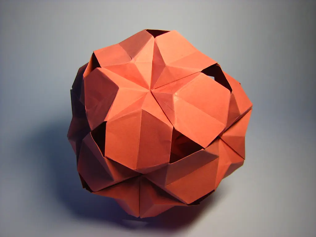An intricate paper tessellation pattern showcasing the exact crease precision required for single sheet folding.