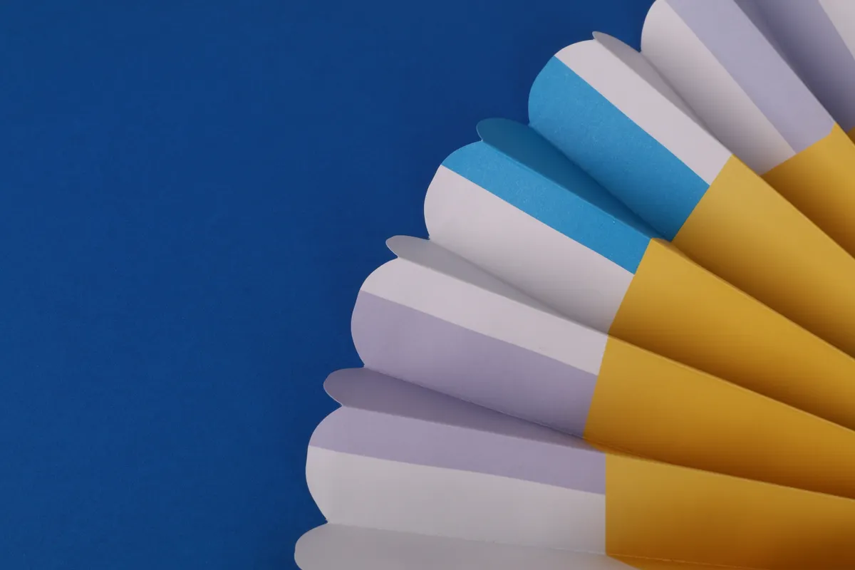 Close-up of an origami petal fold demonstrating correct crease placement and flat alignment.