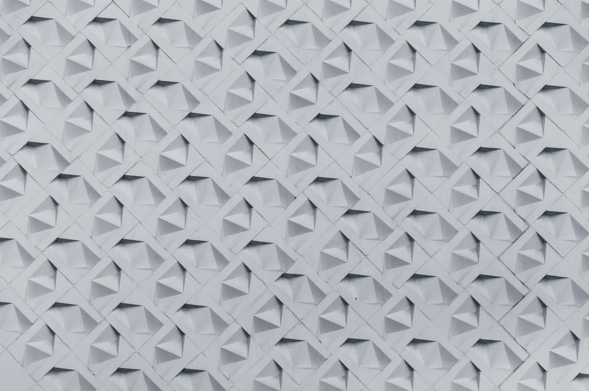 A single sheet of paper folded into a complex and repeating geometric mosaic tessellation pattern.