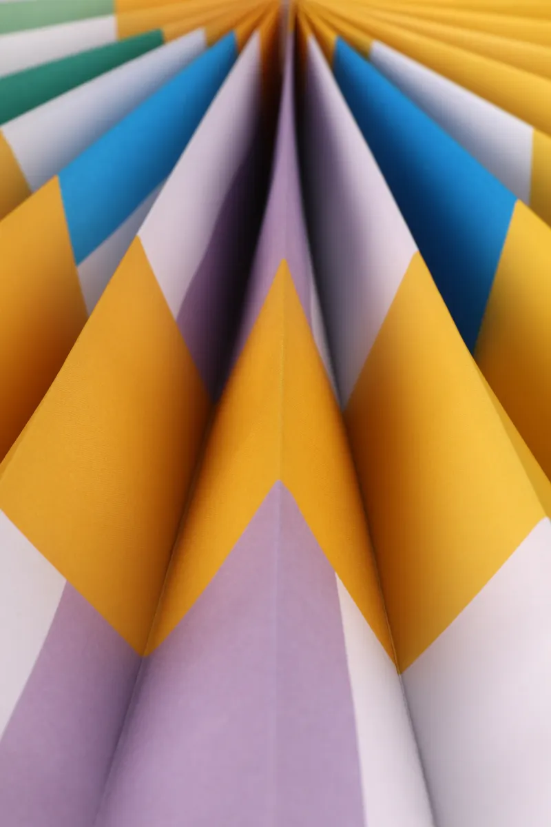 Detailed view of aligning the center crease correctly for an even fold.