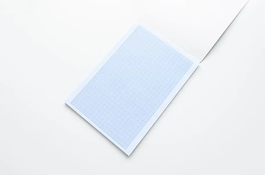 Close up of fingers pinching three creases together to form a clean narrow paper point.