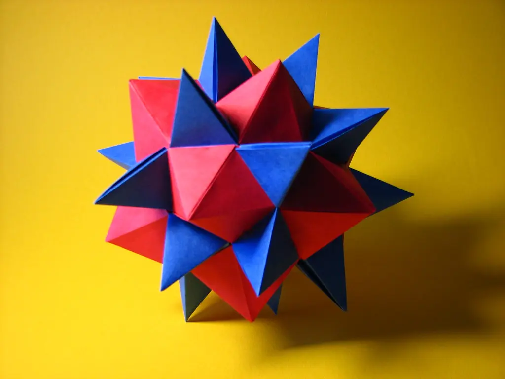 A close-up of a Sonobe unit showing the triangular locking tab and paper pocket.